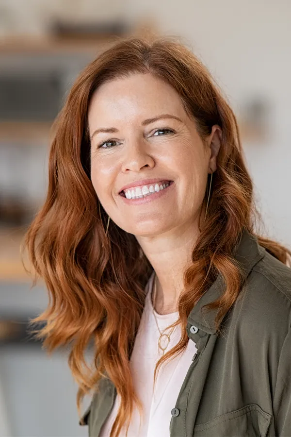 Metformin-Weight-Loss-Specialist A middle-aged couple embrace playfully on a sunny day. Schedule Metformin for weight loss treatment from David Garcia, D.O. in Nashville Metro